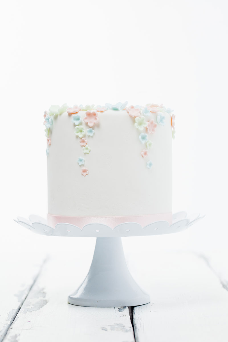 LittleWhiteBirthdayCakeWithFlowers.jpg